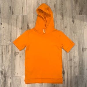 Orange youth top with hood and pockets